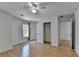 Bedroom features hardwood floors, ceiling fan, window, closet, and white paint at 3517 Harvest Ridge Ln, Buford, GA 30519