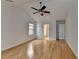 Spacious bedroom featuring vaulted ceilings, ceiling fan, hardwood floors and access to ensuite at 3517 Harvest Ridge Ln, Buford, GA 30519