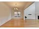 Dining room with hardwood floors, chandelier, and decorative molding, perfect for formal gatherings and Gathering meals at 3517 Harvest Ridge Ln, Buford, GA 30519