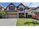Charming two-story home with a two-car garage, brick accents, and a well-manicured front lawn at 3517 Harvest Ridge Ln, Buford, GA 30519
