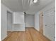 Bright hallway with hardwood floors and white trim provides access to multiple rooms at 3517 Harvest Ridge Ln, Buford, GA 30519