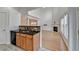 Modern kitchen with granite countertops, wooden cabinetry, a breakfast bar, and stainless steel appliances at 3517 Harvest Ridge Ln, Buford, GA 30519