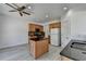 Bright kitchen with an island, granite countertops, and wooden cabinetry at 3517 Harvest Ridge Ln, Buford, GA 30519