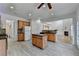 Spacious kitchen with central island, stainless appliances, and view to living room at 3517 Harvest Ridge Ln, Buford, GA 30519