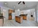 Spacious kitchen with central island, stainless appliances, and view to living room at 3517 Harvest Ridge Ln, Buford, GA 30519