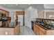 Spacious kitchen with an island, granite countertops, wooden cabinetry, and stainless steel appliances at 3517 Harvest Ridge Ln, Buford, GA 30519