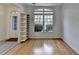 Bright living room featuring large windows, hardwood floors, and neutral paint creating a bright, airy space at 3517 Harvest Ridge Ln, Buford, GA 30519