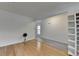 Spacious living room with hardwood floors, neutral walls, and an open layout provides versatile living space at 3517 Harvest Ridge Ln, Buford, GA 30519