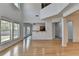 Bright living room with large windows and open floor plan, showcasing hardwood floors and natural light at 3517 Harvest Ridge Ln, Buford, GA 30519