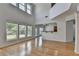 Bright living room with large windows and high ceilings, showcasing the open floor plan and natural light at 3517 Harvest Ridge Ln, Buford, GA 30519