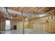 Unfinished basement features exposed ductwork, a support beam, and a door to the outside at 67 Red Top Cir, Emerson, GA 30137