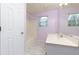 A bathroom featuring a single sink vanity, a shower/tub, and a window for natural light at 67 Red Top Cir, Emerson, GA 30137