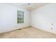 View of a bedroom with neutral walls, ceiling fan, and a window allowing natural light at 67 Red Top Cir, Emerson, GA 30137