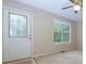 Entryway with decorative glass front door, large window, and neutral carpet at 67 Red Top Cir, Emerson, GA 30137
