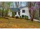 Charming home with a freshly painted exterior, manicured lawn, and an attached garage at 67 Red Top Cir, Emerson, GA 30137