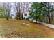 Home exterior featuring beautiful landscaping, driveway, and a shed at 67 Red Top Cir, Emerson, GA 30137