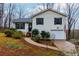 Charming home with neatly landscaped front yard, sidewalk, and black shutters at 67 Red Top Cir, Emerson, GA 30137