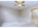 Bright, spacious living room featuring neutral walls and carpet and a ceiling fan at 67 Red Top Cir, Emerson, GA 30137
