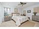 Spacious main bedroom with neutral walls, carpet, ceiling fan, and decorative wall art at 67 Red Top Cir, Emerson, GA 30137