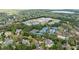 High-angle view of property, neighborhood, and local tennis facilities from above at 2005 Westbourne Way, Alpharetta, GA 30022
