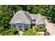 Expansive aerial view of the home surrounded by mature trees showcasing the roof, landscape and outdoor space at 2005 Westbourne Way, Alpharetta, GA 30022