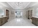 Expansive primary bathroom featuring dual vanities, soaking tub, and abundant natural light with marble flooring at 2005 Westbourne Way, Alpharetta, GA 30022