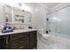 Bathroom features marble floors, vanity, shower and a large mirror at 2005 Westbourne Way, Alpharetta, GA 30022