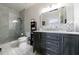 Stylish bathroom featuring a walk-in shower, marbled vanity, and hexagon tile accents at 2005 Westbourne Way, Alpharetta, GA 30022