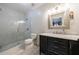 Bathroom featuring a glass shower, vanity, and patterned shower wall at 2005 Westbourne Way, Alpharetta, GA 30022