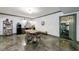View of the dining area with modern decor, seating for four, and an open doorway leading to the fitness room at 2005 Westbourne Way, Alpharetta, GA 30022