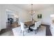 Elegant dining room featuring decorative wainscoting, stylish chairs, and a large dining table at 2005 Westbourne Way, Alpharetta, GA 30022