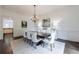 Formal dining room with wainscoting, chandelier, and ample seating for elegant entertaining at 2005 Westbourne Way, Alpharetta, GA 30022