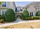 Elegant home featuring manicured landscaping, a stone walkway, and a covered entrance at 2005 Westbourne Way, Alpharetta, GA 30022
