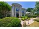 Elegant two-story home with lush landscaping, charming curb appeal, and a welcoming front walkway at 2005 Westbourne Way, Alpharetta, GA 30022
