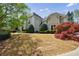 Well-manicured front yard showcases a stately home with lush landscaping and mature trees at 2005 Westbourne Way, Alpharetta, GA 30022
