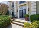 An inviting entryway featuring a stone walkway and beautifully landscaped surroundings at 2005 Westbourne Way, Alpharetta, GA 30022