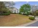 Spacious home with a manicured lawn, lush greenery, and a stately presence at 2005 Westbourne Way, Alpharetta, GA 30022