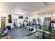 Spacious home gym featuring weights, cardio equipment, and mirrored wall for workout enthusiasts at 2005 Westbourne Way, Alpharetta, GA 30022