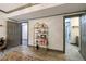Hallway features a decorative etagere, two doorways, and stylish decor at 2005 Westbourne Way, Alpharetta, GA 30022