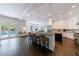 Spacious kitchen with white cabinets, granite countertops, stainless steel appliances, and breakfast bar at 2005 Westbourne Way, Alpharetta, GA 30022