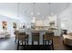 Bright kitchen with a large island, granite countertops, pendant lighting, and a seamless transition to the living area at 2005 Westbourne Way, Alpharetta, GA 30022