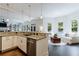 Bright and airy kitchen with granite countertops, stainless steel appliances, and seamless transition to the living area at 2005 Westbourne Way, Alpharetta, GA 30022