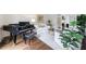Bright living room with a grand piano, comfortable seating, and a decorative indoor tree at 2005 Westbourne Way, Alpharetta, GA 30022