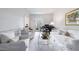 Bright living room boasts white walls, plush seating, piano and french doors to the outdoors at 2005 Westbourne Way, Alpharetta, GA 30022
