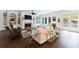 Elegant living room featuring built-in bookshelves, fireplace, dark wood floors and French doors to the pool at 2005 Westbourne Way, Alpharetta, GA 30022