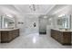 Bright primary bathroom with marble floors, a glass shower, and double vanities at 2005 Westbourne Way, Alpharetta, GA 30022