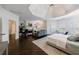 Spacious primary bedroom featuring a fireplace, tray ceiling, and hardwood floors at 2005 Westbourne Way, Alpharetta, GA 30022