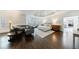 Spacious primary bedroom featuring a seating area, tray ceiling, and hardwood floors at 2005 Westbourne Way, Alpharetta, GA 30022