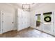 Well-lit mudroom with custom built-in storage, tiled floor, and easy access to the outdoors at 2005 Westbourne Way, Alpharetta, GA 30022