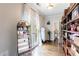 Walk-in closet with hardwood floors, built-in shelving, a decorative mirror, and natural light at 2005 Westbourne Way, Alpharetta, GA 30022